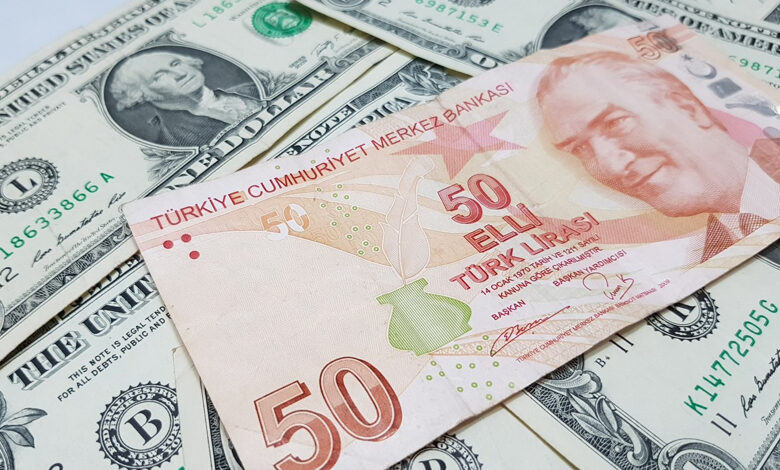 Turkish lira moved to a low record versus the dollar, euro and pound