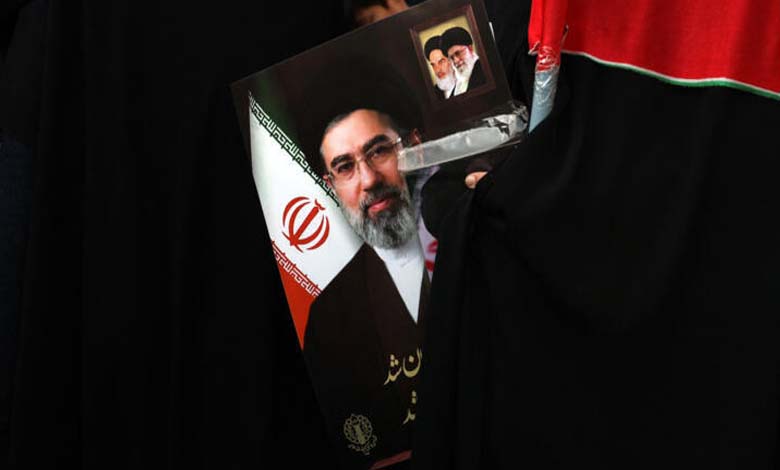 How does the Iranian regime buy the loyalty of its supporters?