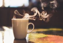 How can hot drinks help lower body temperature?